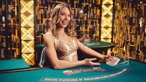 prediksi 99 live casino studio with multiple gaming tables and professional dealers